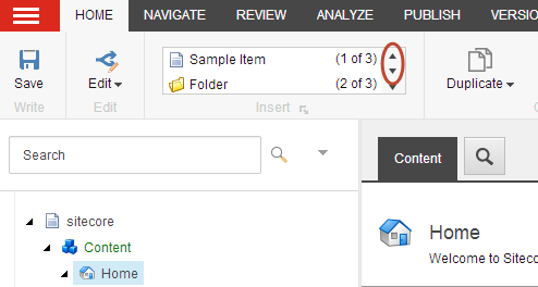 The up and down arrows in the Insert group.